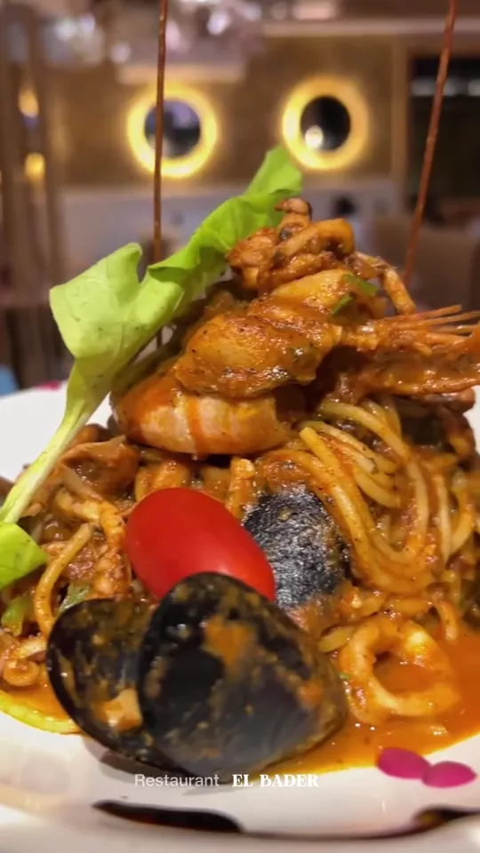 A seafood pasta dish plated at Restaurant El Bader